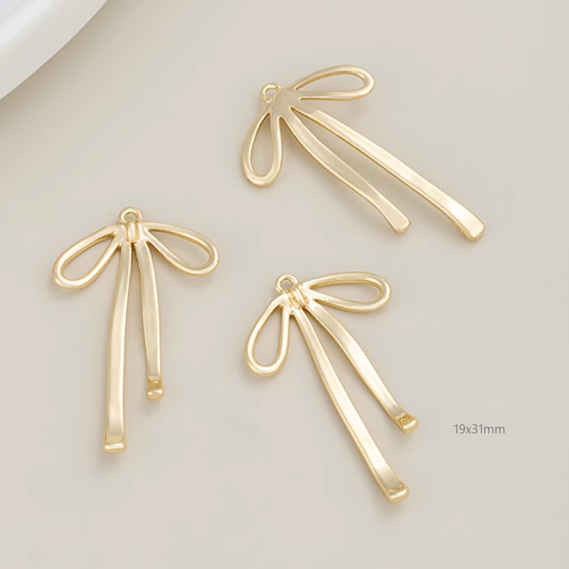 Brass Electroplated Zircon Bow Pendant